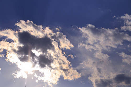 The sun , the sky and a cloud